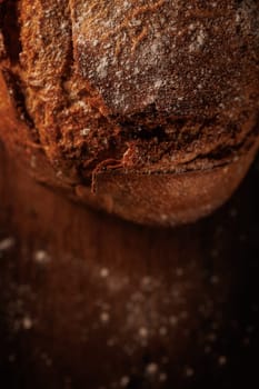 freshly baked bread on wooden table with loaf details