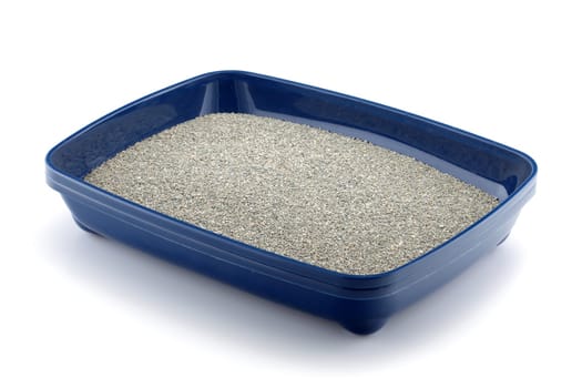Blue cat litter tray with clumping litter isolated on white