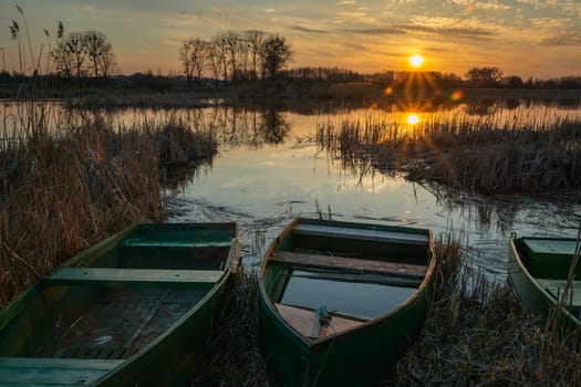 Boats on the shore of the lake and sunset, Stankow, Poland