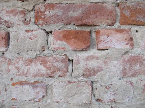 Brick masonry freed from plaster, unplastered house brick wall without wall plastering