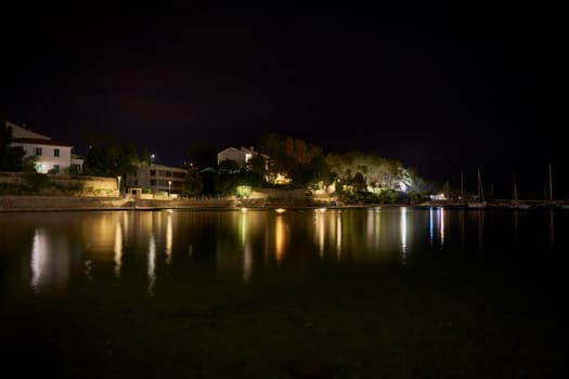View of Punta Di Galetto beach near the old town of Krk on the Adriatic Sea in Croatia at night