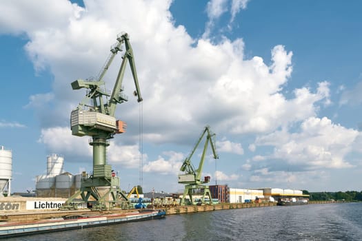 Cranes and industry in the southern harbor of the Berlin district of Spandau on the Havel River