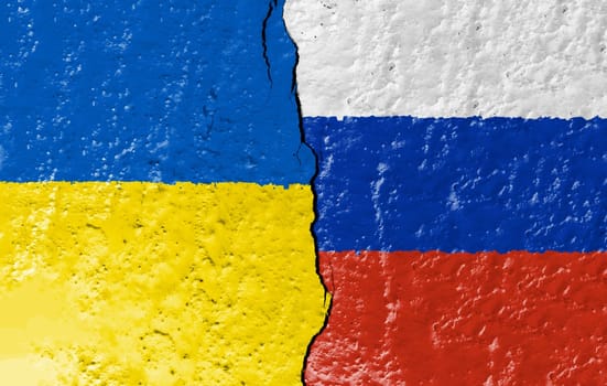the flags of Ukraine and Russia painted on a ruined wall and divided by a crack. International diplomatic relations.