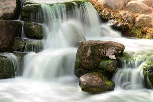 Man made waterfall or cascade with silky water