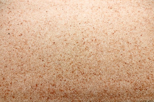 All natural fine grain Himalayan pink salt with some red crystals horizontal background. Horizontal background of some red salt crystals with mostly pink Himalayan fine grain salt ingredient..