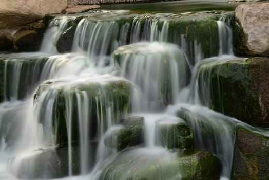 Man made waterfall or cascade with silky water