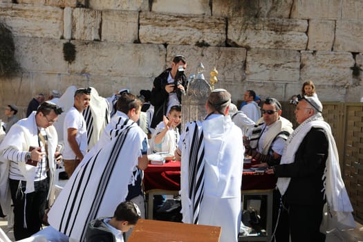Bar Mitzvah Ceremony at the Western Wall in Jerusalem Old City. Bar Mitzvah is the Jewish rite of passage from boyhood to manhood. Israel