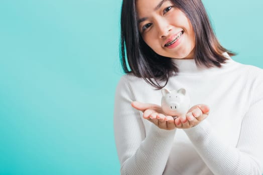 money, save, glasses, bank, pig, girl, happy, piggy, indian, optic, people, spectacles, asian, budget, buying, funny, holding, business, economy, eyewear, sale, specs, women, woman, student, teenage, teen, investment, positive, smile, lady, background, box, young, beautiful, isolated, blue, female, person, finance, financial, banking, concept, attractive, wealth, thai, smiling, income, portrait, piggybank