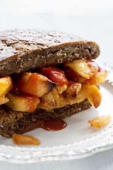 close up of traditional british chip butty sandwich