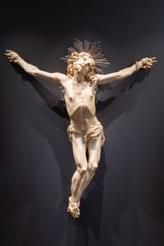 Jesus Christ - Old crucifix, Catholic Church, on black background with copy space