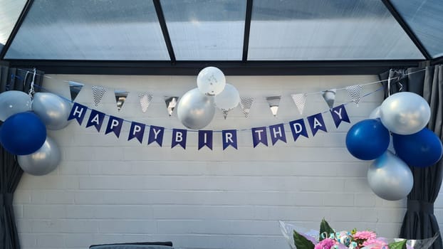 Celebration banner. Happy birthday party background with golden ribbons, confetti and balloons. Realistic anniversary
