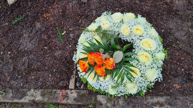 Flower arrangement or flower wreath as decoration or grave decoration