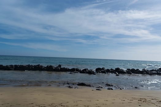 Beach of Gran Canaria in Meloneras, beach near lighthouse.