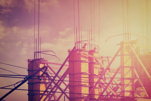 Construction site at sunset. Cross processed.