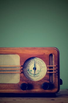 Antique radio on retro background