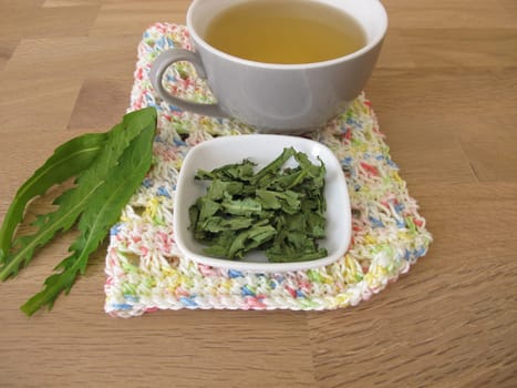 Homemade dandelion tea, tea with dried dandelion herb