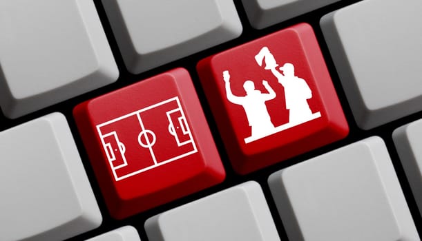 Soccer fans on red computer keyboard