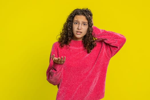 Sad young Caucasian girl feeling hopelessness loneliness, nervous breakdown, loses becoming surprised by lottery results, bad fortune, loss unlucky news. Teenager child isolated on yellow background