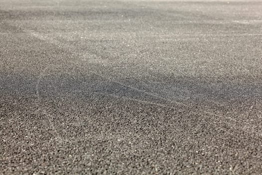 Detail of asphalt road from low angle. Abstract urban background.