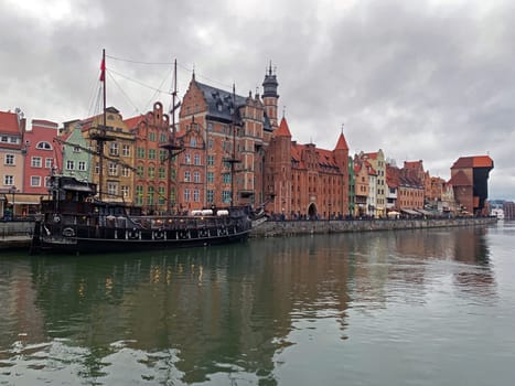 Dramatic picture of the historical buildings of Gdansk on the cold Nowa Motlawa channel in Poland