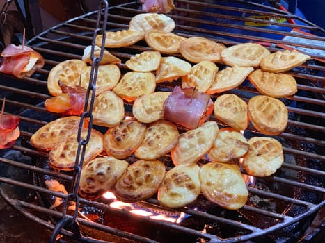 Traditional Polish smoked goat cheese roasted over the fire with bacon in Gdansk in Poland during Christmas