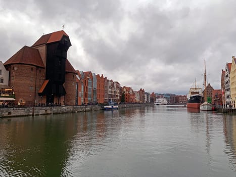 The historical Brama Żuraw black building on the Nowa Motlawa river in Gdansk in Poland