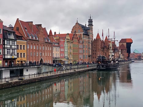 Dramatic picture of the historical buildings of Gdansk on the cold Nowa Motlawa channel in Poland