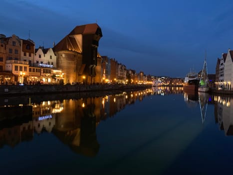 Gdansk channels with Brama Żuraw during a clear sky night in Poland