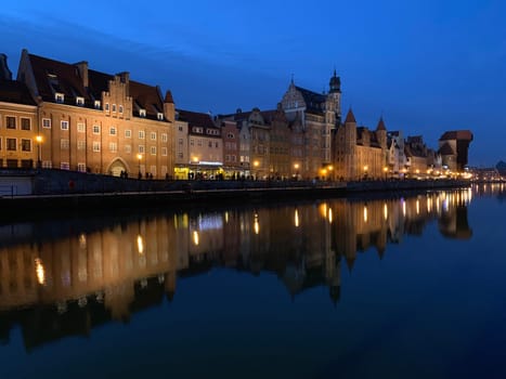 Dramatic picture of the historical buildings of Gdansk on the cold Nowa Motlawa channel in Poland