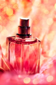 Parfume bottle with sparkling background