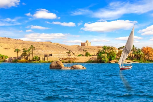 Sailboat in the Nile and the view of Aswan, Egypt.