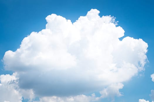 Large singleCumulonimbus clouds. cumulus cloud. Puffy or cotton like or fluffy cloud blue sky white fluffy clouds over blue sky landscape.