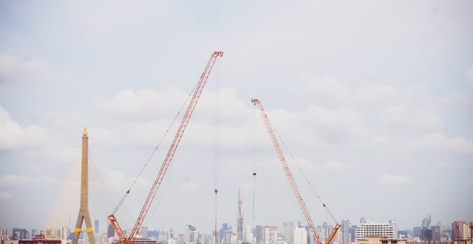 Panorama scenic of Construction Skyline with Blue sky Background and crane on construction Site. Cityscape Urban Facility