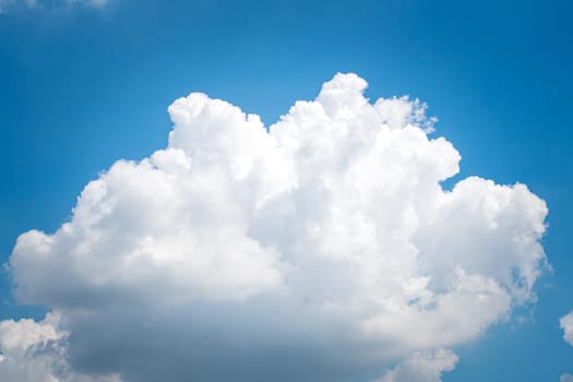 Large singleCumulonimbus clouds. cumulus cloud. Puffy or cotton like or fluffy cloud blue sky white fluffy clouds over blue sky landscape.