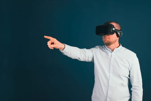 Metaverse digital cyber world technology. Businessman with VR glasses using AR augmented reality NFT, futuristic lifestyle concept