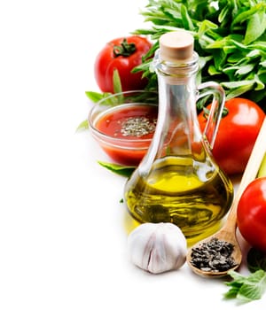 Olive oil, tomato and herbs over white background
