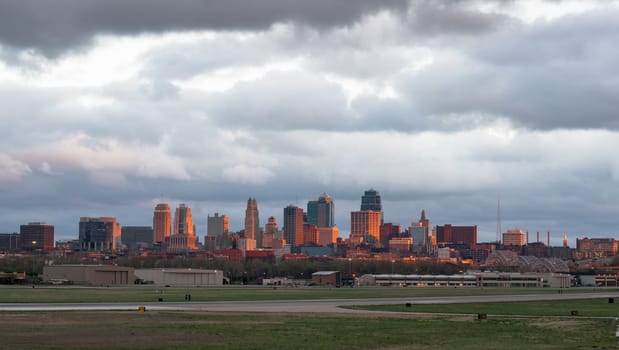 A rare view of downtown Kansas City lite up for just a moment by the setting sun