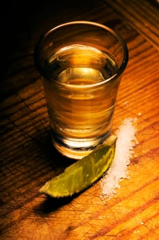 Tequila shot with lime slice and salt