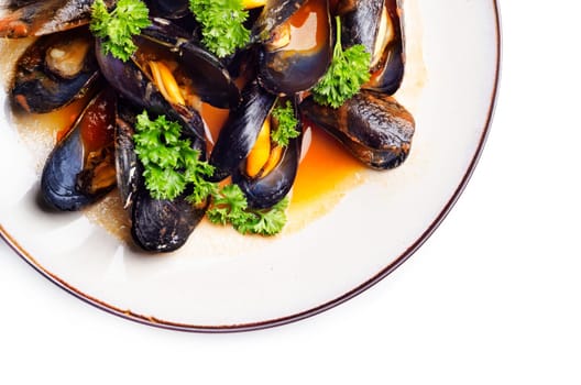 Mussels with tomato sauce served in plate