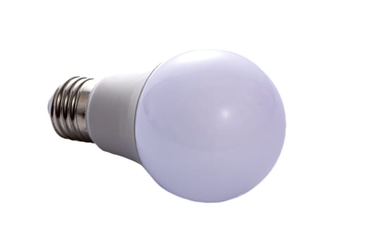 A white LED lamp with an E27 base lies on a white insulated background. High quality photo