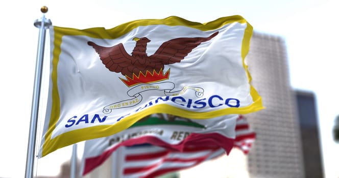 San Francisco city flag waving in the wind with California state and United States national flags blurred in background. San Francisco municipal flag