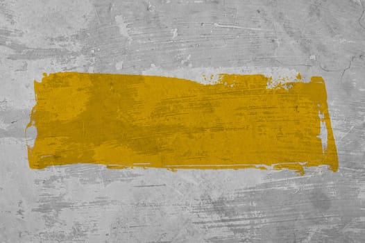 Grey concrete wall with yellow stripe