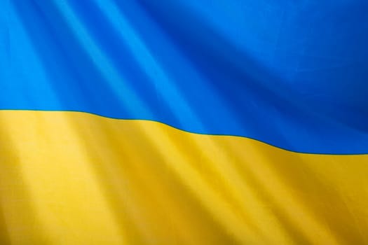 Flag of Ukraine, UA. Blue and yellow colors. Close up shot, background