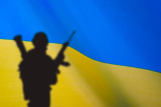 Flag of Ukraine with soldiers shadows. Russian-Ukrainian crisis, conflict.