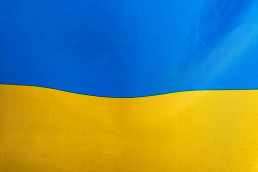 Flag of Ukraine, UA. Blue and yellow colors. Close up shot, background