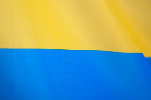 Flag of Ukraine, UA. Blue and yellow colors. Close up shot, background