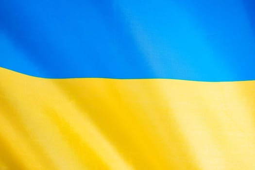 Flag of Ukraine, UA. Blue and yellow colors. Close up shot, background