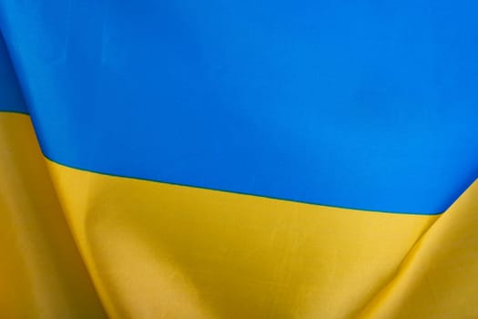 Flag of Ukraine, UA. Blue and yellow colors. Close up shot, background