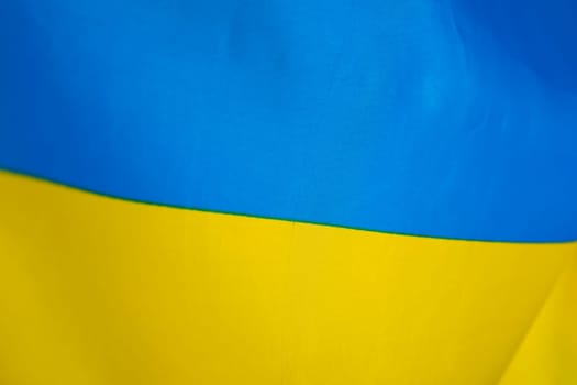 Flag of Ukraine, UA. Blue and yellow colors. Close up shot, background