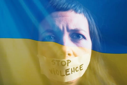 War between Russia and Ukraine. Woman with sad sight, Stop text over Ukraine flag.